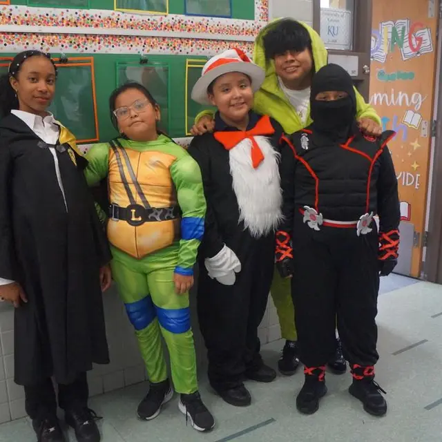 Scholars dressed as a ninja turtle, the Cat in the Hat and other storybook characters