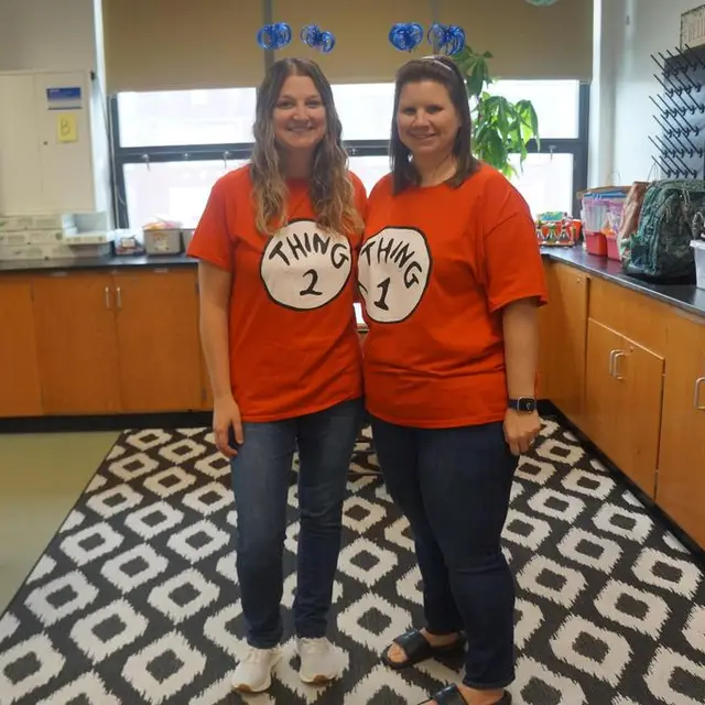 Two teachers dressed as Thing 1 and Thing 2