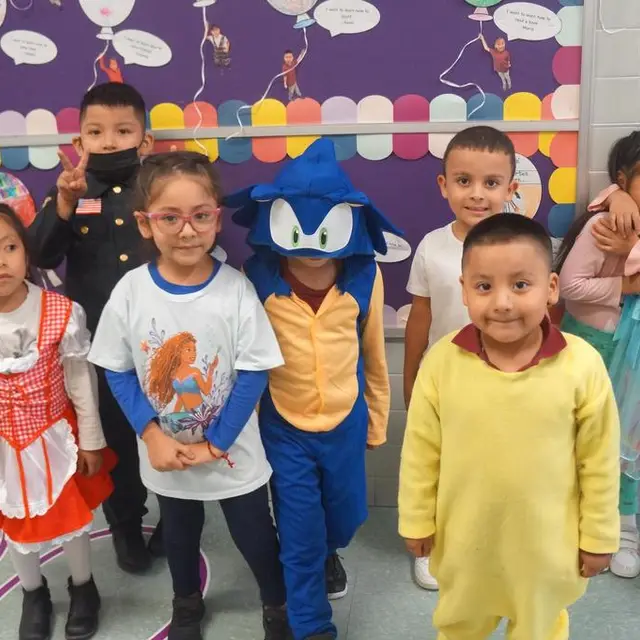 Young scholars in costume, one dressed as a blue hedgehog