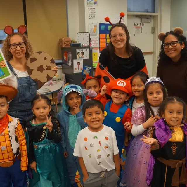 A class in costume with three teachers wearing animal ears